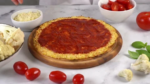 Close up of woman's hands preparing healthy cauliflower pizza Stock Footage 137096294