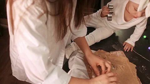 Close-up of a woman’s hands rolling dough for sweet gingerbread cookies, Stock Footage 288450675