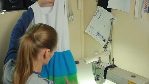 Close-up of woman's hands sewing an overlock at sewing machine. Stock Footage 90072327