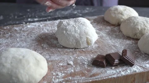 Close-up of a woman’s hands shaping buns. Concept  making chocolate buns. Stock Footage 337703001