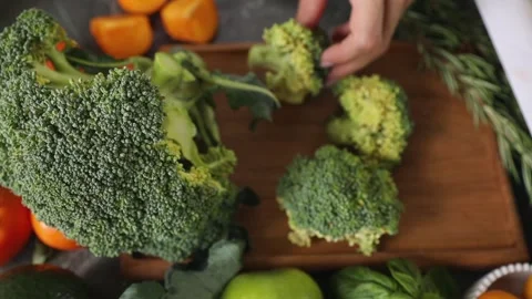 Close-up of a woman's hands sorting broccoli Stock Footage 276896532