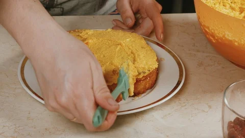 Close-up of woman's hands spreading a cream pie Stock Footage 106467029