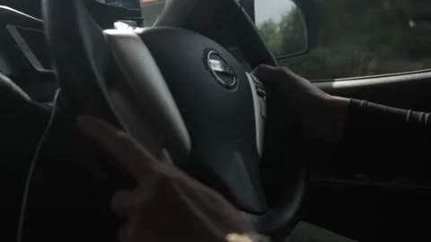Close up of a woman's hands on a steering wheel 動画素材 137838895