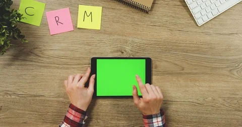 Close up on the woman's hands taping on the black horizontal tablet device with Stock Footage 89954878