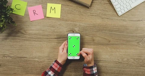 Close up on the woman's hands taping on the white vertical smartphone with a 스톡 동영상 89954367