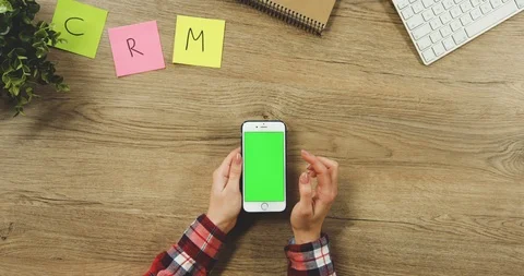 Close up on the woman's hands taping on the white vertical smartphone with a Stock Footage 89954588