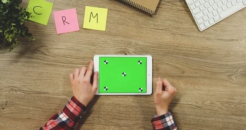 Close up on the woman's hands taping on the white horizontal tablet device with Stock Footage 89955342