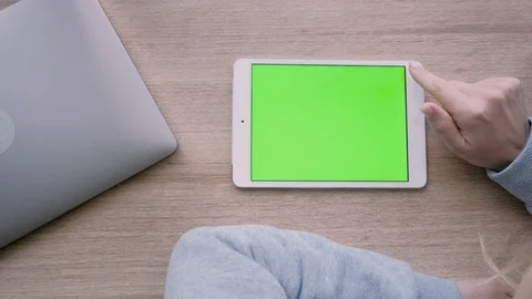 Close-up of a woman’s hands touching and scrolling tablet pc. Stock Footage 93298704