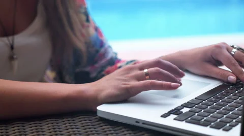Close up of woman's hands typing on a laptop computer outdoors. 動画素材 57633307
