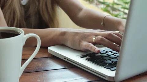 Close up of woman's hands typing on laptop computer, outdoors. Stock Footage 57637596