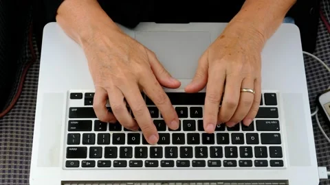 Close up of woman's hands typing on a laptop Stock Footage 138720462