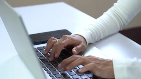 Close up of woman's hands typing on a laptop. Working concept Stock Footage 285699857