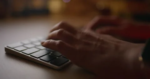 Close-up of woman's hands typing on laptop in office Stock Footage 305048924