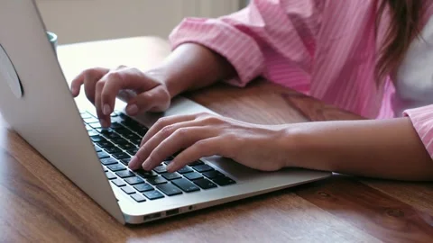 Close-up of Woman's Hands Typing on a Laptop Stock-Footage 334015539