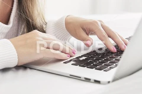 Close up of Womans Hands Typing with Laptop in Bed Shallow DOF Stock Photos
