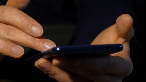 Close-up woman's hands uses smartphone browsing internet for online business Video stock 97444290
