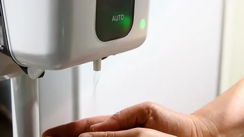 Close up of woman's hands using alcohol gel disinfecting hands. Stock Footage 222586166