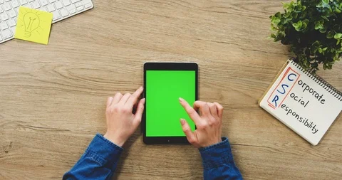 Close up of the woman's hands using the black vertical tablet computer with a Video stock 89977701