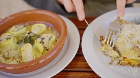 Close-up of woman's hands Using a fork to eat delicious food. Slow motion Stock Footage 269220055