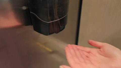 Close up woman's hands using the hand sanitizer to prevent the COVID infection Video stock 136713740