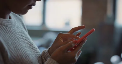 Close up of womans hands using smart phone technology to read architectural Stock Footage 57919308