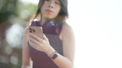 Close Up of Woman's Hands Using a Smartphone in a Natural Outdoor Setting. Stock Footage 316657443