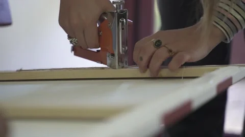 Close Up Of Woman's Hands Using Stapler On Art Frame Stock Footage 247631881