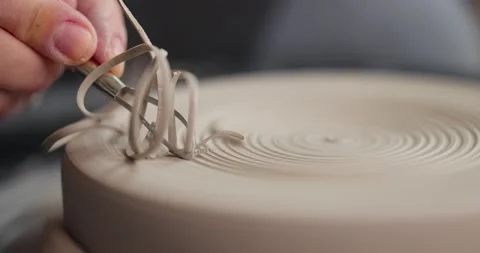 Close-up of woman's hands which shaping workpiece with a tool in a pottery Stock-Footage 155463117
