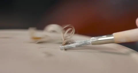 Close-up of woman's hands which shaping workpiece with a tool in a pottery Stock Footage 155598912