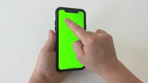 Close-up a woman's hands working on green screen on mobile phone Stock Footage 274683173
