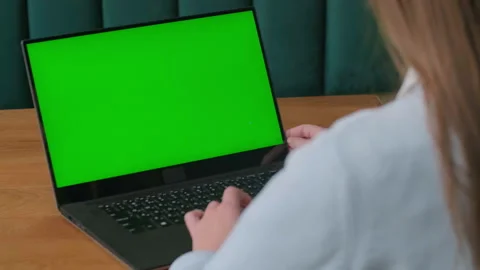 Close up of a womans hands working on green screen on a laptop 스톡 동영상 279653131
