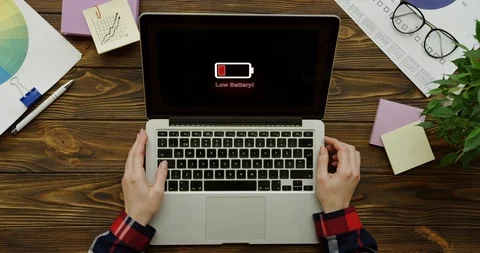 Close up of the woman's hands working on the laptop computer on the wooden desk Stock Footage 93971614