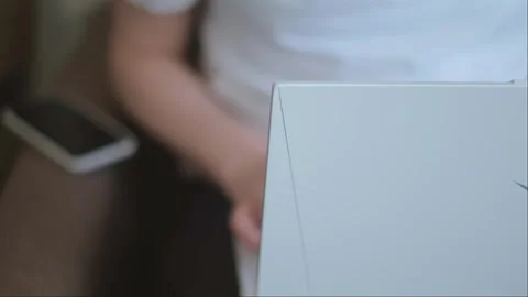 A close-up of a woman's hands working on a laptop, a freelancer completing tasks Stock Footage 276183110