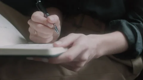 Close up of woman's hands writing in a notebook Video stock 131057543