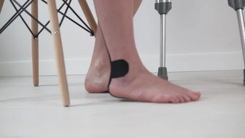 Close-up of the woman's leg in the teip on the floor Video stock 154031644