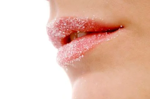 Close-up of a woman's lips covered with sugar Stock Photos