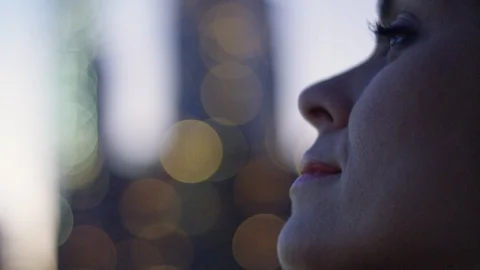 Close-up of woman's profile with Manhattan, NY in the background Stock Footage 85575338