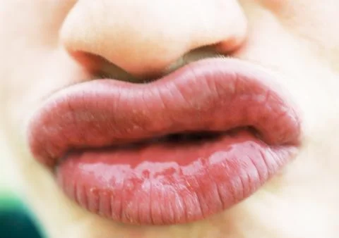 Close up of woman's puckered lips Stock Photos