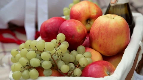Close-up of a woman's tender hand, taking a red apple from the basket. Stock Footage 85666575