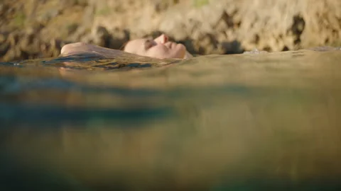Close-Up of a Woman's Upper Body Floatin... | Stock Video | Pond5