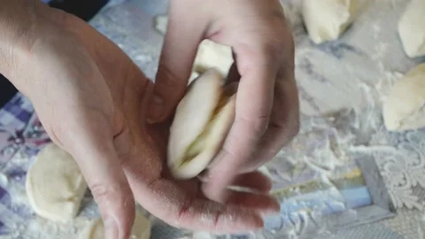 Close -up women hands making dumplings with potato,Ukrainian national dish Stock Footage 173658565