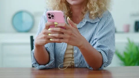 Close-up of women hands using mobile phone, typing text on her smartphone Stock Footage 218565953
