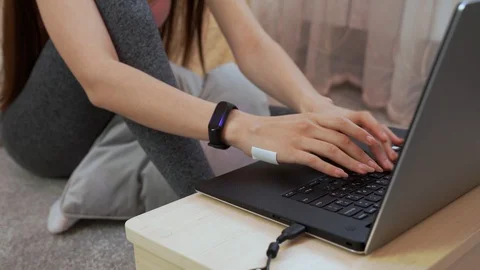 Close up women hands working or typing on computer notebook at home Stock Footage 129677756