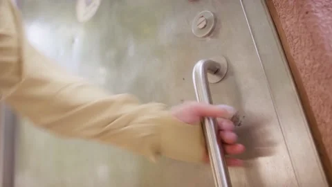 Close up women try open close public toilet door Stock Footage 203890482