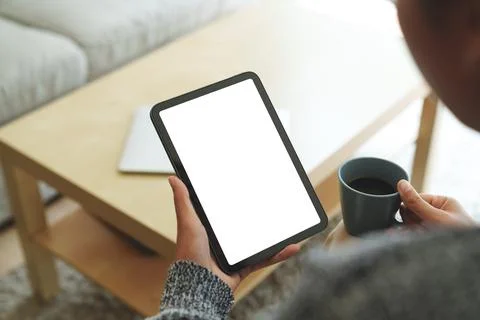 Close-up women using digital tablet white screen in living room Stock Photos