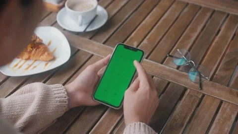 Close-up women using phone green screen in the morning Stock Footage 201606330