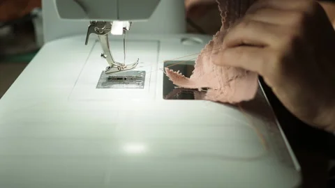 Close up of women using sewing machine Stock Footage 162972354