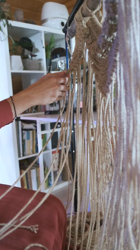 Close-up women weaving macrame from a rope at home Stock-Footage 237707396