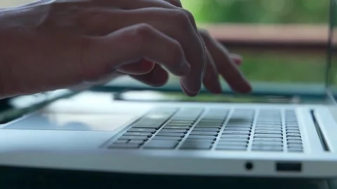 Close-up of women's brushes that quickly type on a laptop Video stock 234021104