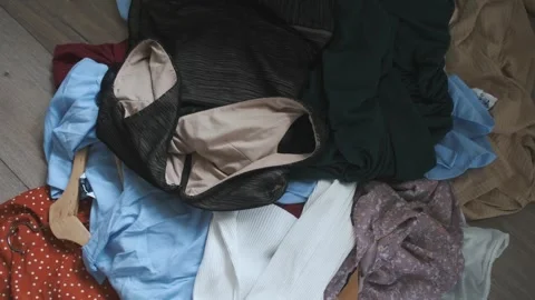 Close-up of women's clothes being thrown on the floor Stock Footage 252047987